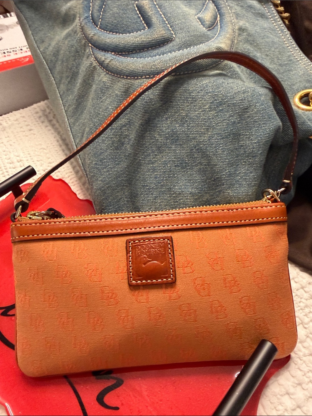Dooney & Bourke Orange Logo Wristlet with Brown Leather Trim